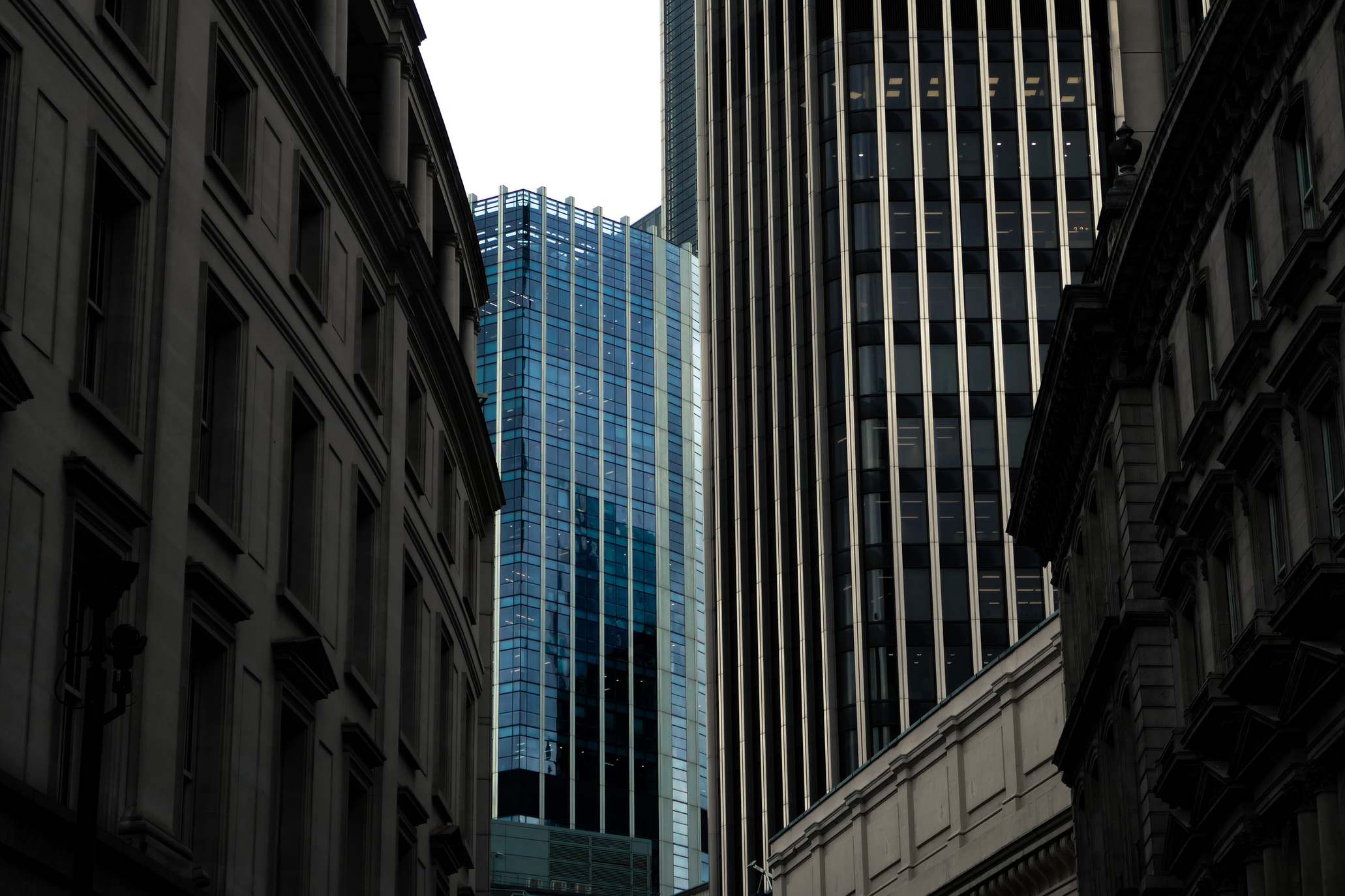 Urban street with office towers in a business district, modern skyscrapers with glass facades